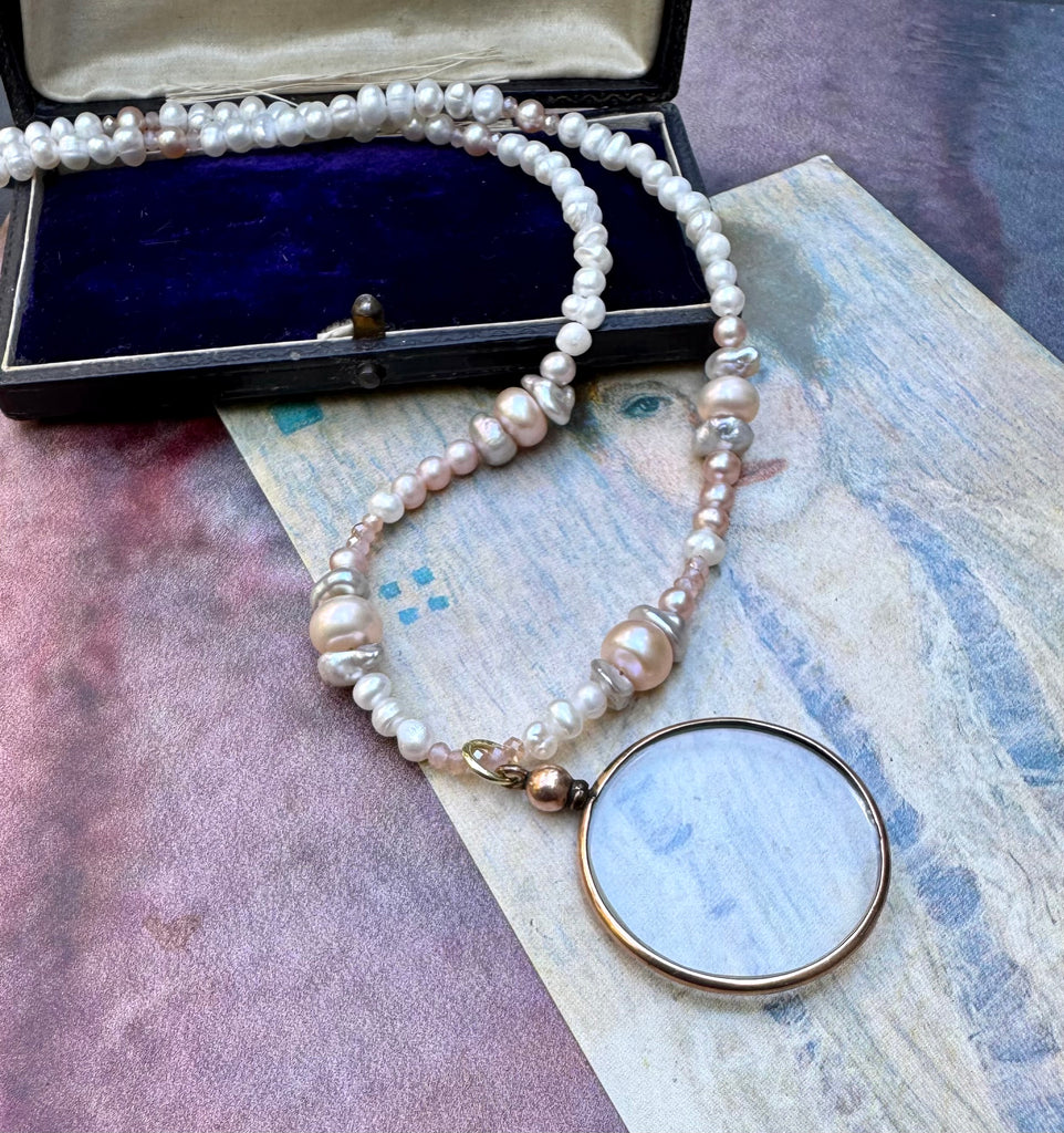 Vonk jewellery rolled gold double sided photo locket on a vintage postcard and with a vintage jewellery box