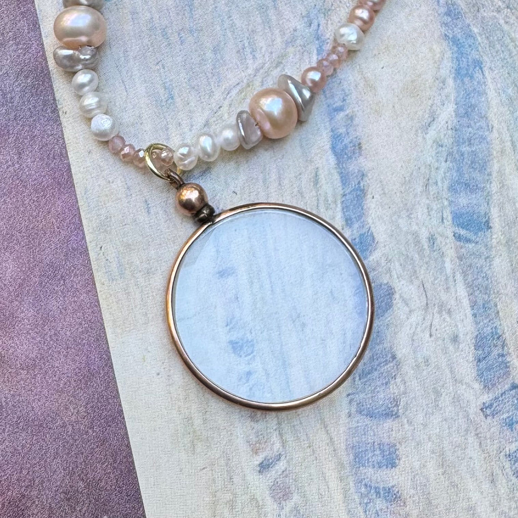 Vonk jewellery rolled gold double sided photo locket on a vintage postcard and with a vintage jewellery box