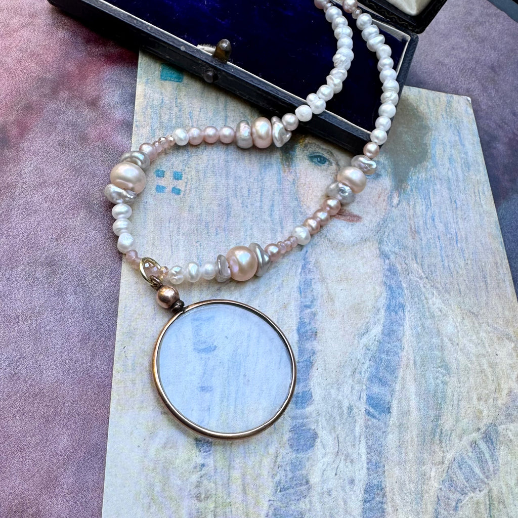 Vonk jewellery rolled gold double sided photo locket on a vintage postcard and with a vintage jewellery box