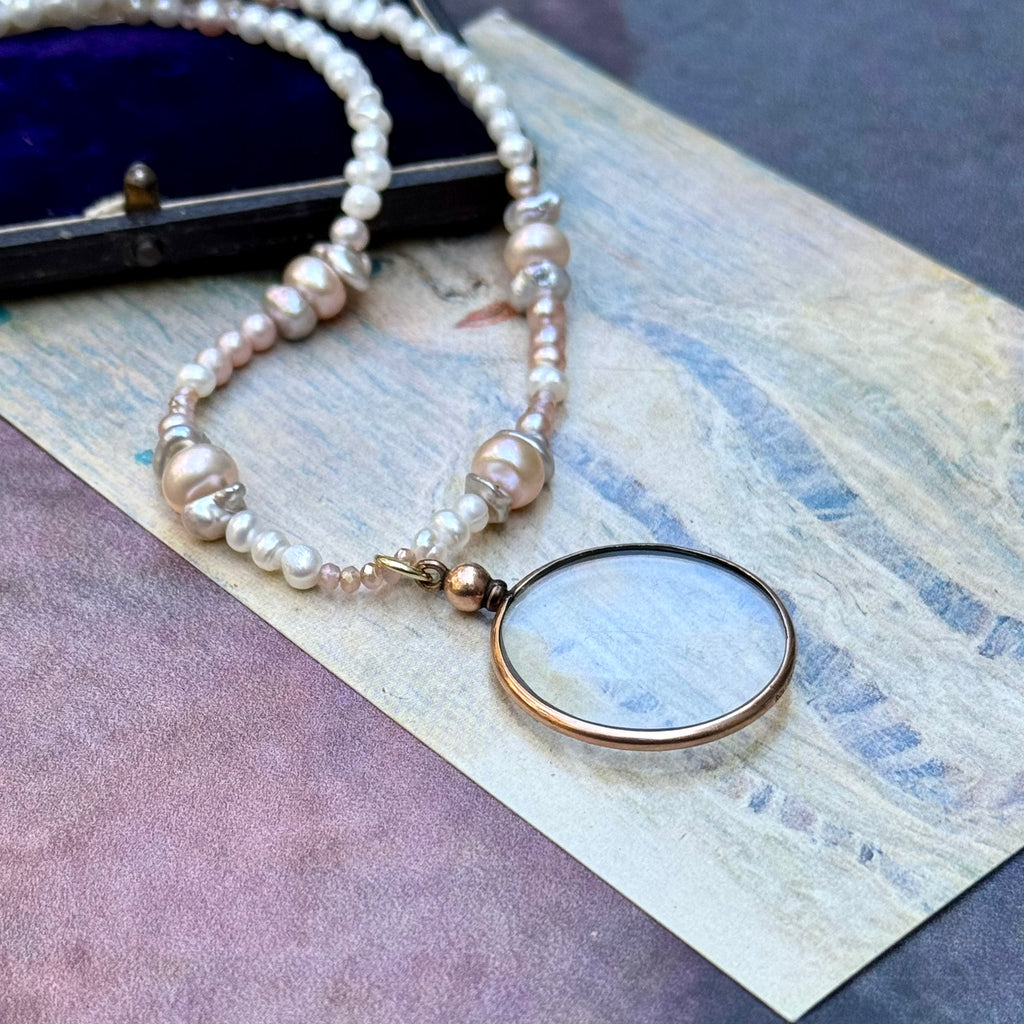 Vonk jewellery rolled gold double sided photo locket on a vintage postcard and with a vintage jewellery box
