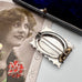 Vonk Jewellery antique sterling silver aesthetic brooch with swallow engraving on a vintage jewellery box