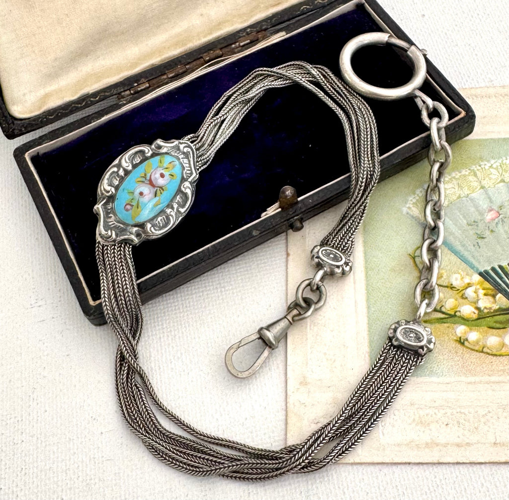 Antique French silver albertina chain on a vintage jewelelry box and with a vintage postcard