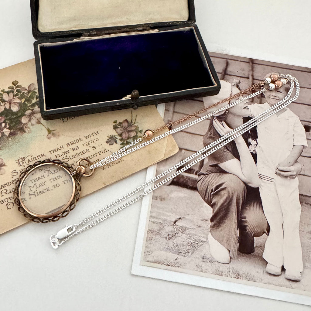 Vonk Jewellery antique rolled rose gold double sided photo locket necklace on vintage postcards and with a vintage jewellery box