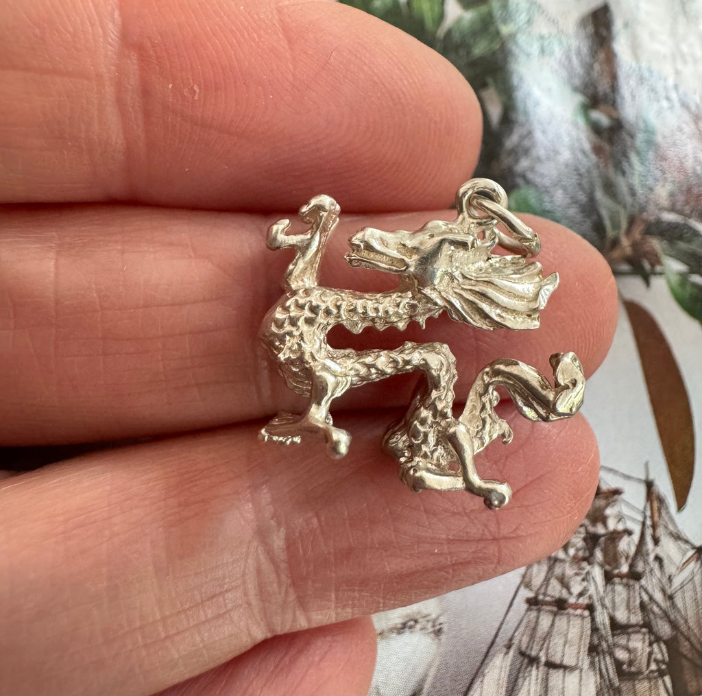 Vonk Jewellery silver Chinese dragon charm on a womans hand