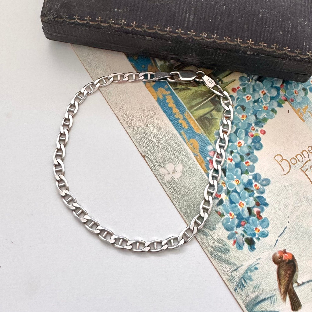 Vonk Jewellery sterling silver mariner link bracelet on an old jewellery box and on a vintage Christmas postcard