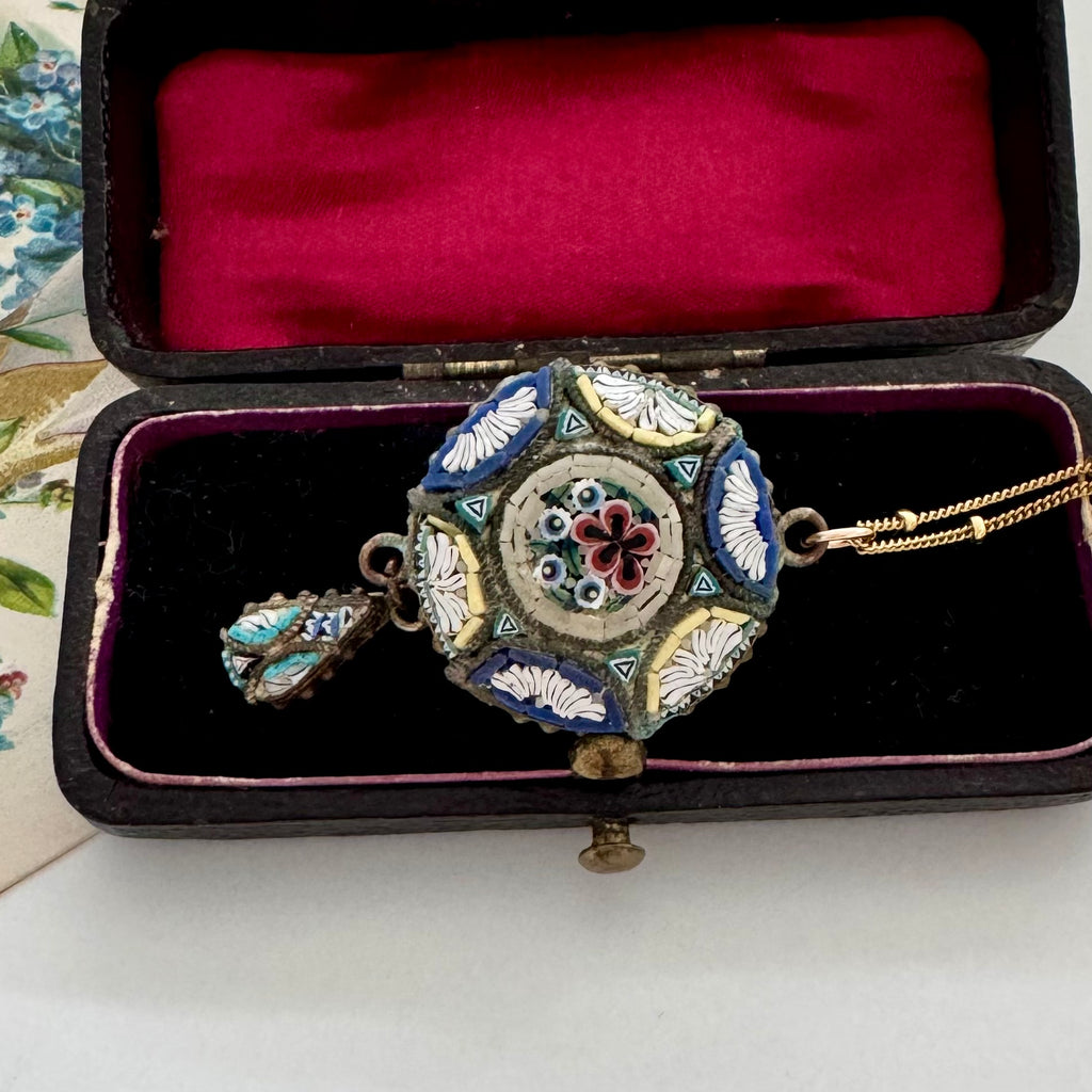 Decorative micro mosaic neckalce in an open jewelry box