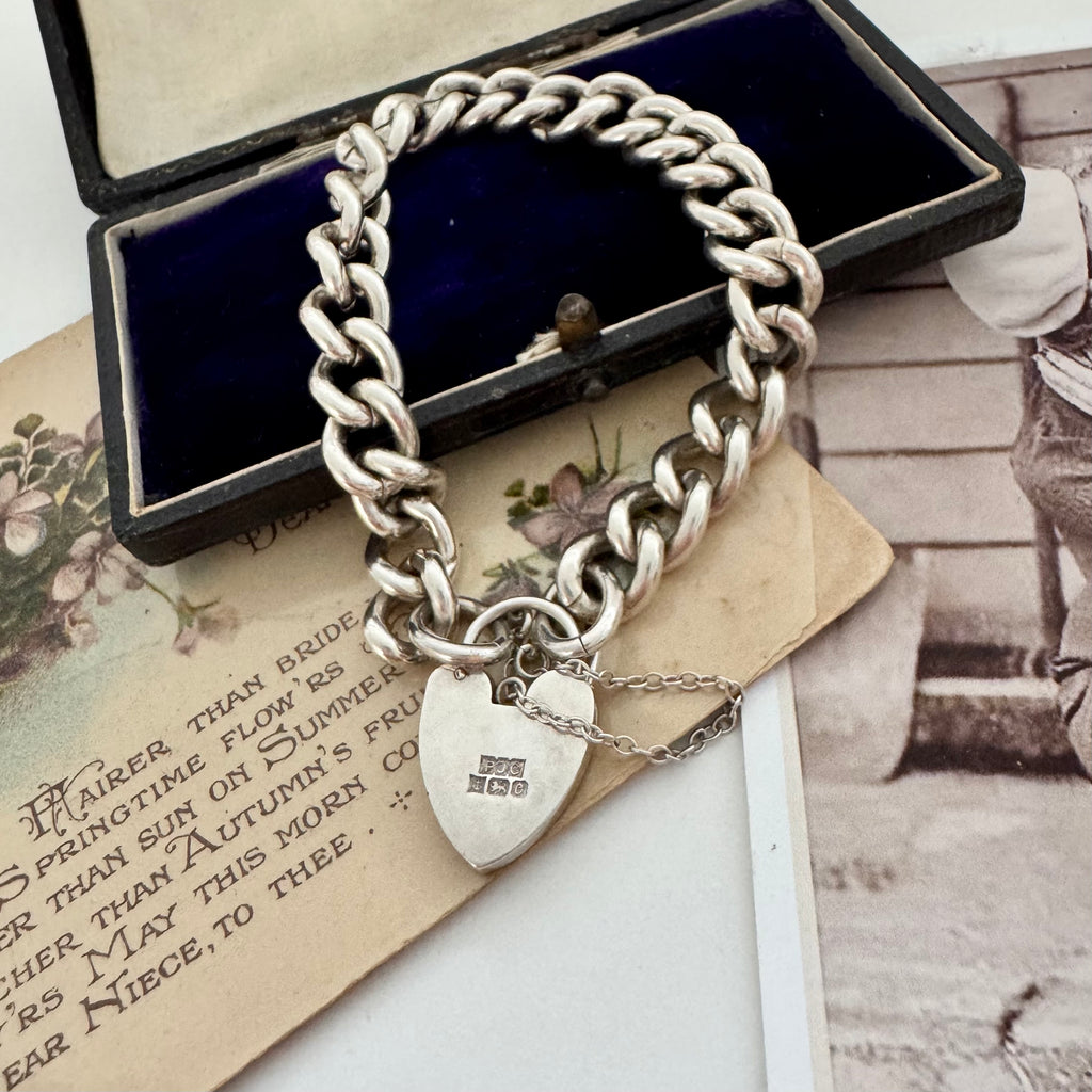 Vonk Jewellery heavy sterling silver curb link chain bracelet with heart padlock clasp on vintage postcards and with a vintage jewellery box