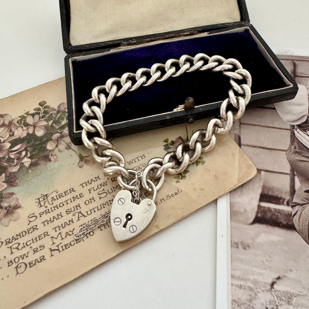 Vonk Jewellery heavy sterling silver curb link chain bracelet with heart padlock clasp on vintage postcards and with a vintage jewellery box
