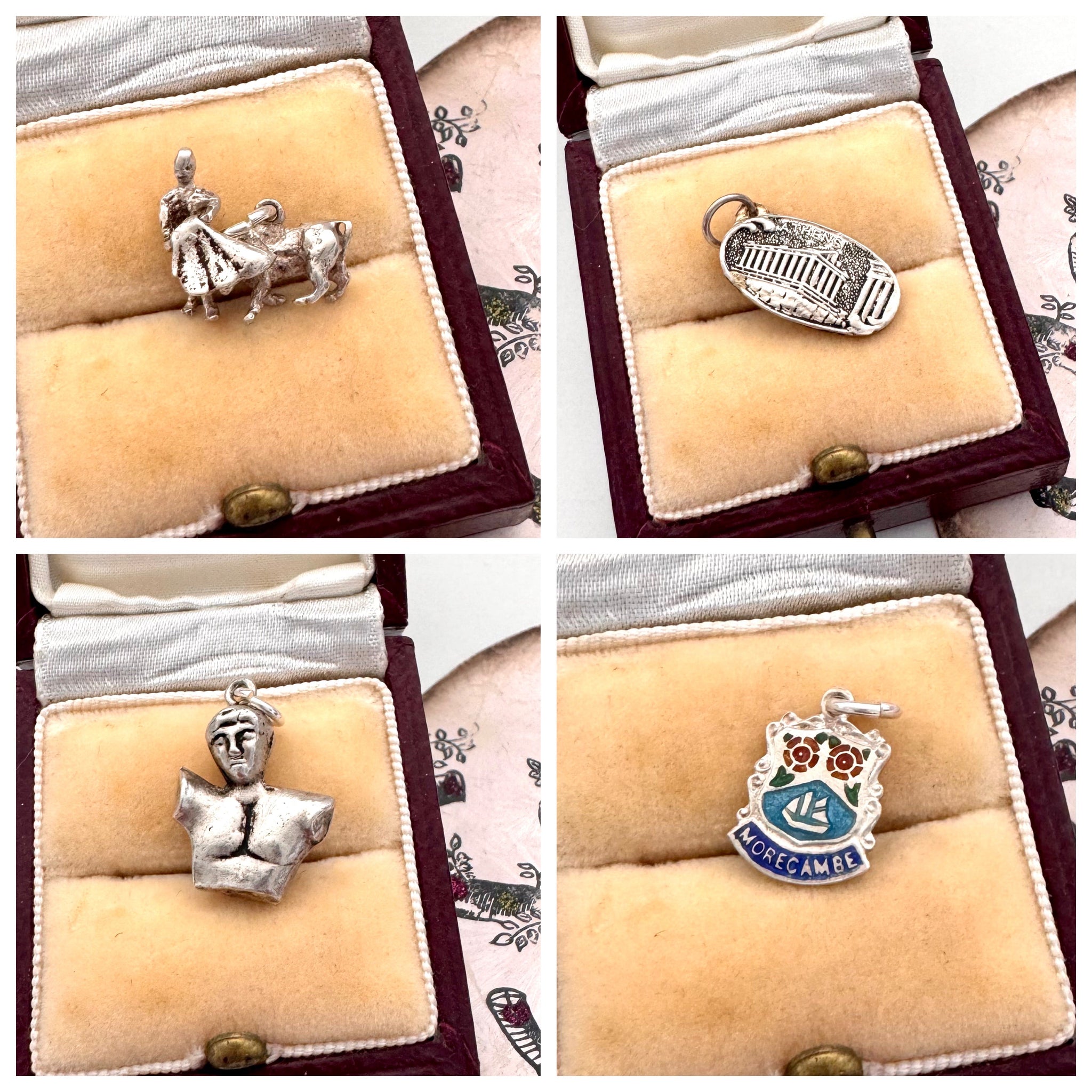 A collage of vintage silver charms all in a jewelelry box