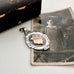 Silver and rose gold 1933 watch fob pendant  with an old photograph of a woman.