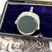 Antique 1896 Chester hallmarked carnelian and bloodstone spinning fob on a jewellery box.