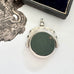 Antique 1896 Chester hallmarked carnelian and bloodstone spinning fob on a jewellery box.