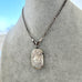 Antique silver watch chain necklace with a sterling silver antique vesta case pendant on a mannequin bust.