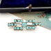 Art Deco era blue paste brooch  on a white surface
