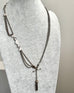 Antique Victorian continental silver triple strand Albertina watch chain with tassel on a grey mannequin