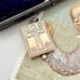 Antique early vintage silver reliquary locket or pendant with an engraving of the crucifixion on a picture of an angel