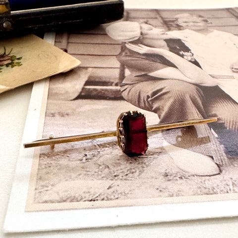 Vonk jewellery red paste stone 9ct gold bar brooch on a vintage photo and postcard