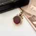 Antique carnelian and bloodstone rolled gold spinning fob with an old jewellery box and antique photo