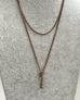 Antique A.H.B & C rolled rose gold guard chain with opal slider on a grey mannrquin