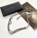 Antique albertina chain on a white background and with an old postcard and box