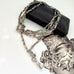 Antique silver fancy link guard chain on an old jewellery box and with an engraved picture in the corner