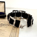 Antique sterling silver buckle bracelet on a   vintage box on an old paper background