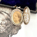 Inside an antique Victorian era silver locket with an engraving of an urn and an old jewellery box