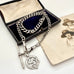 Edwardian sterling silver Albert watch chain with Isle Of Man Triskelion fob and edwardian T bar on an old photo with an old jewellery box