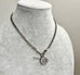 Edwardian sterling silver Albert watch chain with Isle Of Man Triskelion fob and edwardian T bar on a grey mannequin