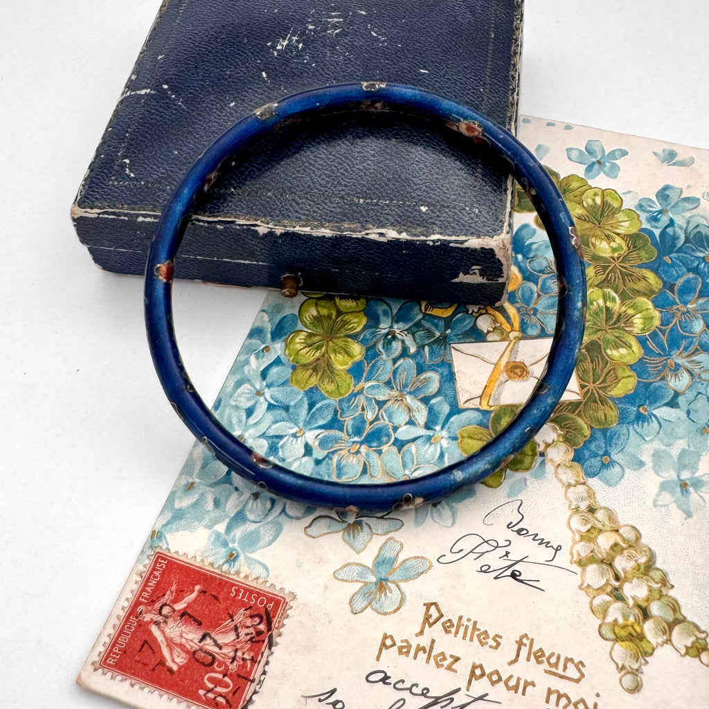 Vintage blue cloisonne bangle on an old jewellery box and vintage postcard