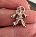 Vonk Jewellery vintage silver clown charm on a picture of an old masters painting
