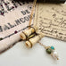 Vonk Jewellery antique Stanhope binocular and pearl charm necklace on vintage postcards