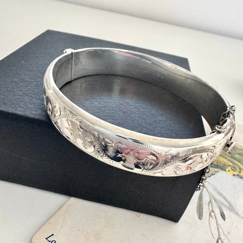 Vonk Jewellery vintage sterling silver half engraved bangle on a black box