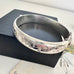 Vonk Jewellery vintage sterling silver half engraved bangle on a black box