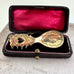 Decorative Swedish Sami spoon with intricate designs in a black case with red interior