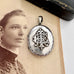 Vonk Jewellery Victorian silver Amity, Eternity and Infinity locket on an antique photo of a woman