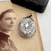 Vonk Jewellery Victorian silver Amity, Eternity and Infinity locket on an antique photo of a woman