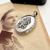 Vonk Jewellery Victorian silver Amity, Eternity and Infinity locket on an antique photo of a woman