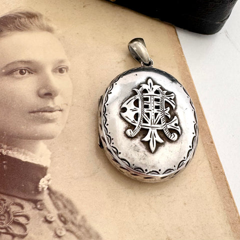 Vonk Jewellery Victorian silver Amity, Eternity and Infinity locket on an antique photo of a woman