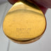 Gold fill locket with 'HANDLEY' branding on a white background