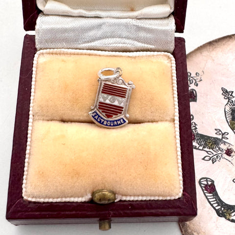 Vintage silver Eastbourne travel charm on a jewellery box