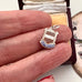 Vintage silver Eastbourne travel charm on a jewellery box and in a woman's hand