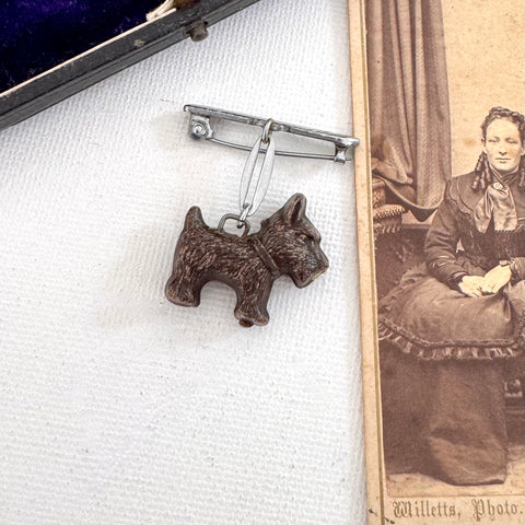 Vintage brooch of a dog on an old photograph