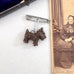 Vintage brooch of a dog on an old photograph