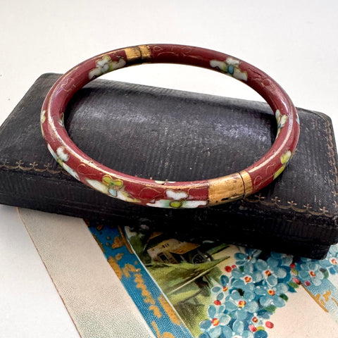 Vintage brown cloisonne bangle on an old jewellery box and with a vintage Christmas card