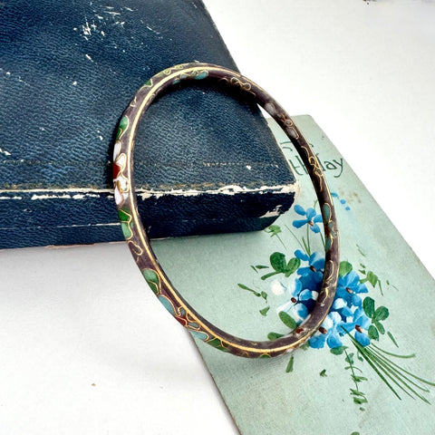 Vintage taupe cloisonne bangle on an old floral postcard and jewellery box