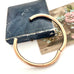 Antique gold fill bracelet on an old box with a white background