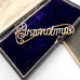 Vintage wire name Grandma brooch in a blue velvet box