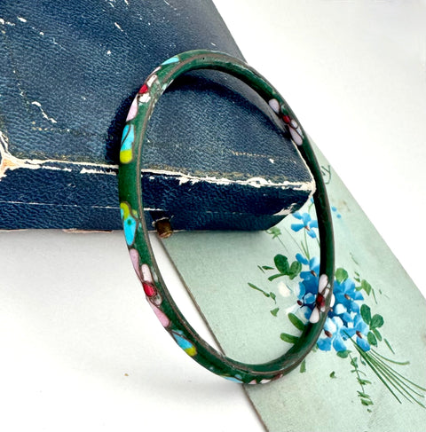 Vintage green cloisonne bangle on an old floral postcard and jewellery box