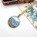 Vintage hand painted pendant featuring a scene of Rapallo on the Italian riviera. It is with a vintage postcard and old jewellery box